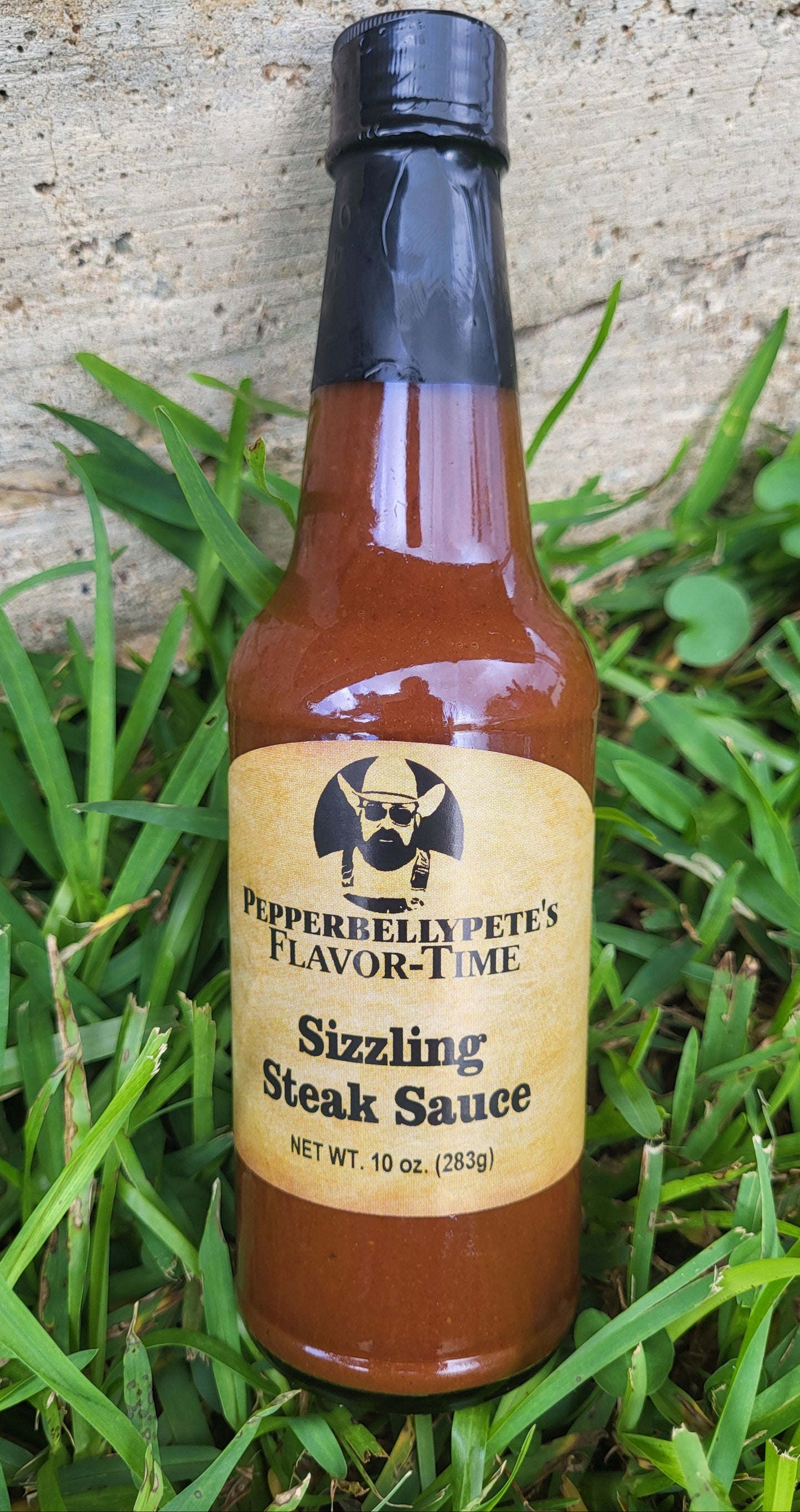 Bottle of Pepper Belly Pete's Steak & Burger Sauce - bold grilling flavor from Texas outdoor